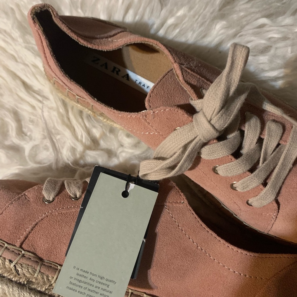 Suade pink sneaker, very soft too big for my daughter. Brand new with tags.